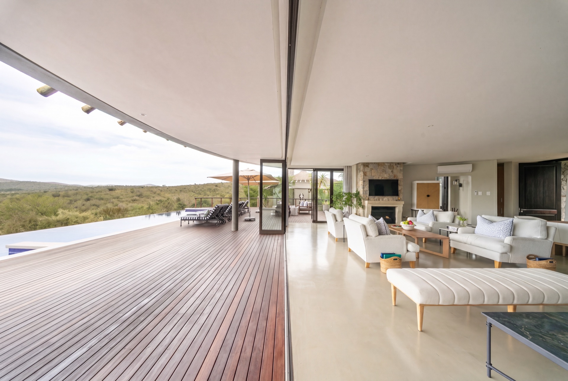 Open living space and deck at Villa Mhlosinga overlooking the reserve