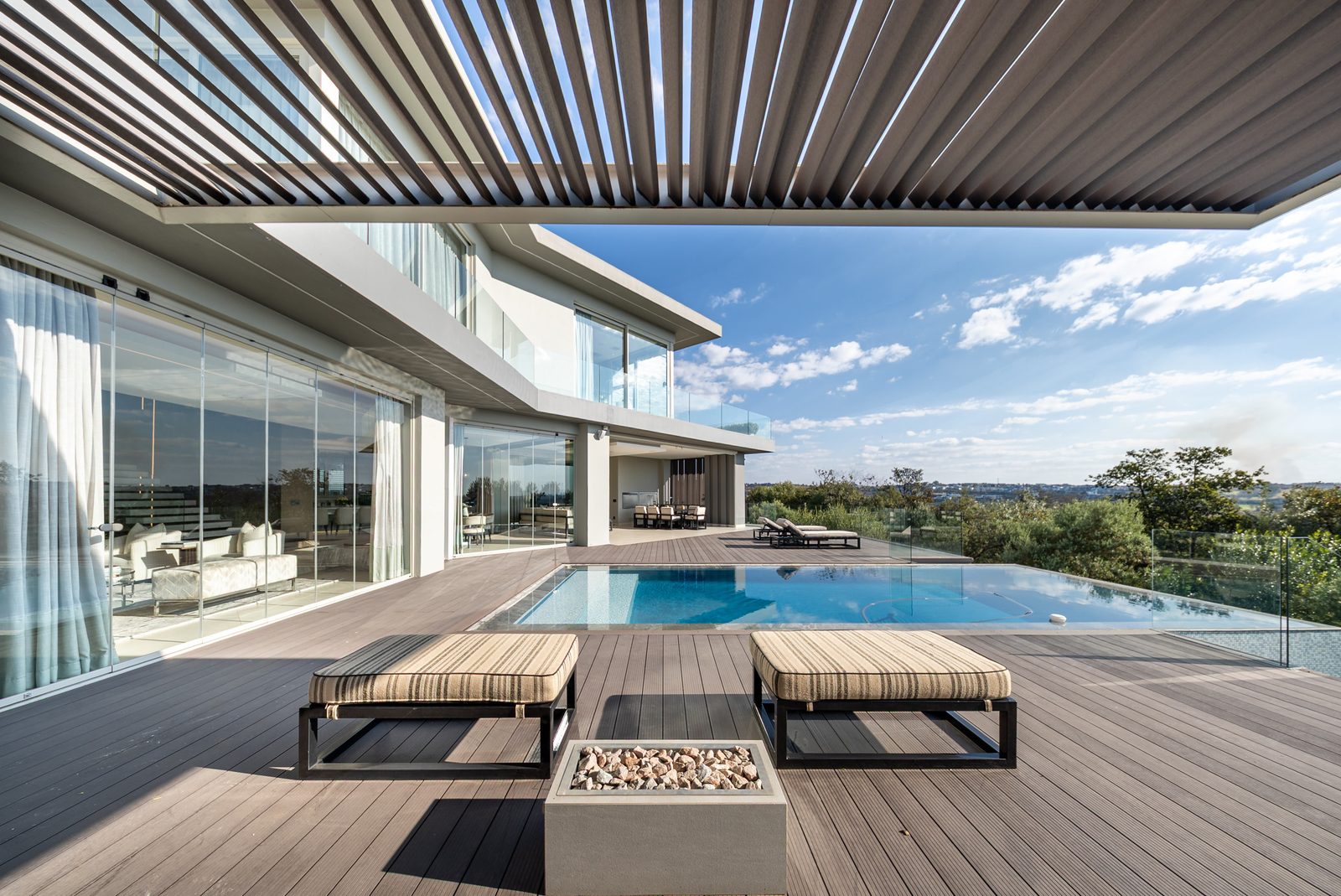 Pool deck with pergola, fire pit and loungers at Villa SC