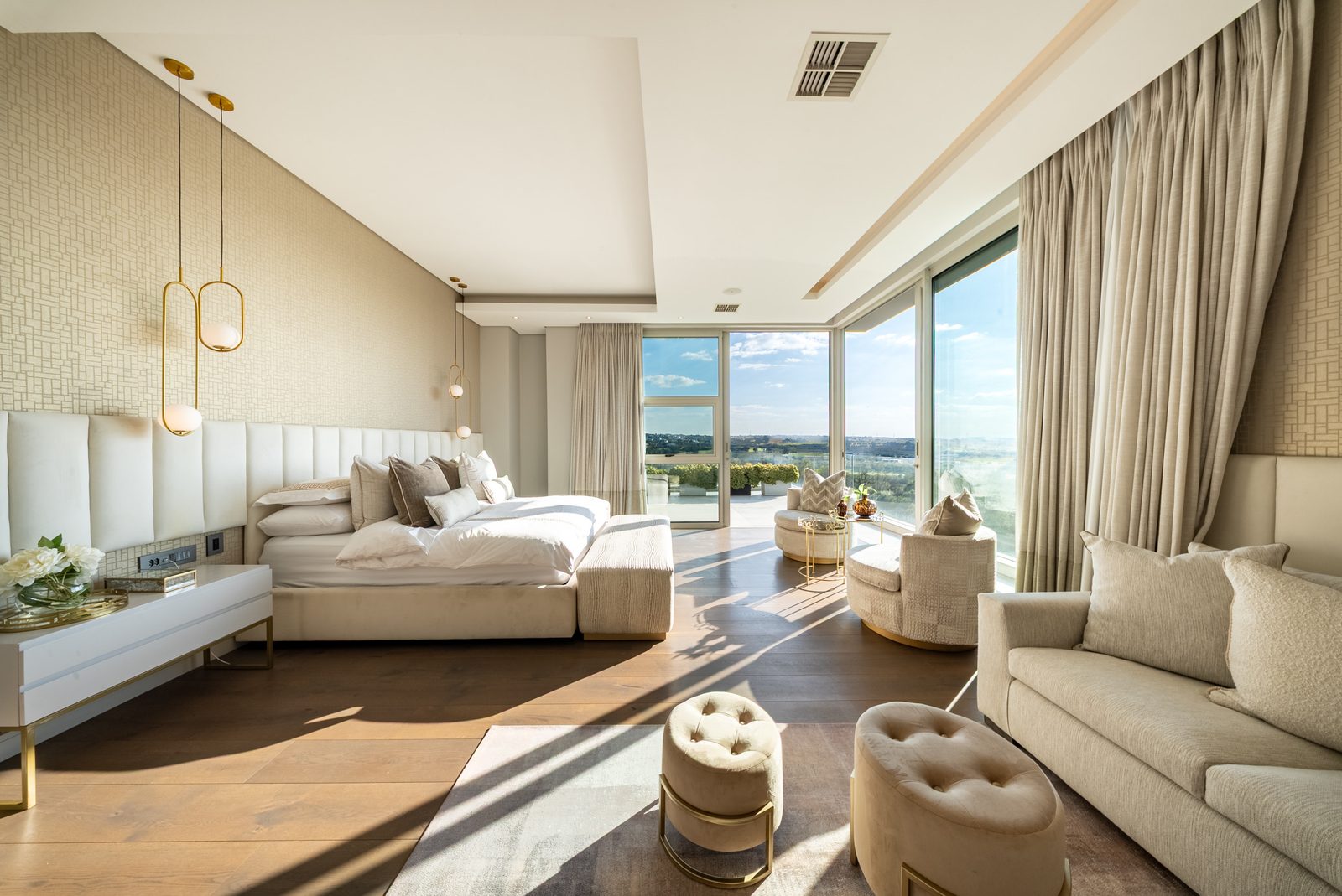 Principal bedroom opening to the wraparound balcony and parkland view
